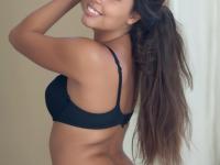 Latina female sports a smile on her pretty face while modeling in lingerie - Photo #8