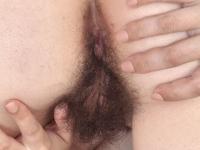 Brunette amateur Effy uncovers her bushy vagina and natural tits on a bed - Photo #14