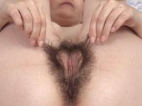 Brunette amateur Effy uncovers her bushy vagina and natural tits on a bed - Photo #20