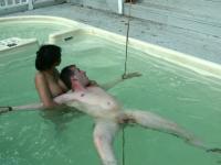 Petite Latina and a sweet Asian girl fuck several restrained sex slaves - Photo #16