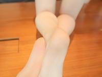 Cute Asian girl sports feet adorned in sheer stockings while wearing lingerie - Photo #4