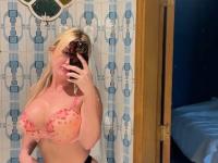 Sultry blonde takes self shots while sporting a strapon cock - Photo #4