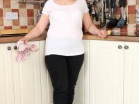 Chubby MILF Michelle F strips naked and fingers her horny cunt in the kitchen - Photo #2