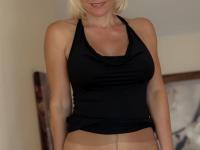 Older blonde MILF Jan Burton rolls down her hose in OTK boots - Photo #3