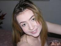 Young amateur shows her bald pussy and asshole while getting totally naked - Photo #18