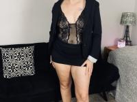 Older woman Lil Ms Muffet takes off her clothes while wearing glasses and heels - Photo #3