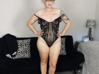 Older woman Lil Ms Muffet takes off her clothes while wearing glasses and heels - Photo #10