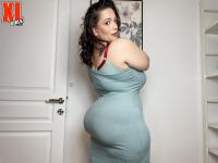 Big brunette Mia Sweetheart models a clingy dress before a POV action on a bed - Photo #4