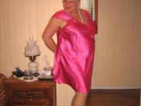 Silver haired nan Girdle Goddess pulls her hose down around her knees on a bed - Photo #1