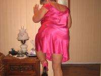 Silver haired nan Girdle Goddess pulls her hose down around her knees on a bed - Photo #3