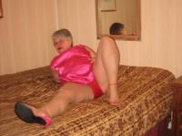 Silver haired nan Girdle Goddess pulls her hose down around her knees on a bed - Photo #10