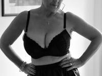 Old woman with short hair and floppy tits dons a strapon in fishnet pantyhose - Photo #5