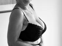 Old woman with short hair and floppy tits dons a strapon in fishnet pantyhose - Photo #7