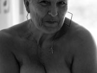 Old woman with short hair and floppy tits dons a strapon in fishnet pantyhose - Photo #9