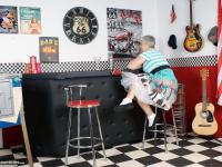 Old American lady Savana exposes her big butt in basement bar - Photo #1
