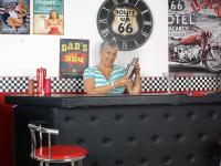 Old American lady Savana exposes her big butt in basement bar - Photo #11