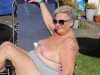 Fat nan Valgasmic Exposed licks a shoe while exposing herself in the backyard - Photo #3
