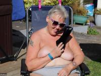 Fat nan Valgasmic Exposed licks a shoe while exposing herself in the backyard - Photo #4