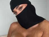 Solo girl models non-nude in black lingerie and with a hijab - Photo #4