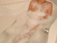 Sexy amateur MILF Stefani playing with her big boobs in the bathtub - Photo #1
