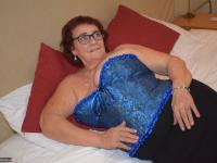 Overweight granny Phillipas Ladies undoes her bustier during solo action - Photo #2