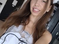 Naughty maid Alisha strips down to her see-through pantyhose in a bedroom solo - Photo #1