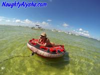 Big titted amateur lounges on an air mattress while naked in a ball cap - Photo #1