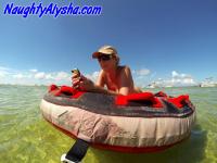 Big titted amateur lounges on an air mattress while naked in a ball cap - Photo #2