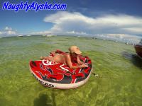 Big titted amateur lounges on an air mattress while naked in a ball cap - Photo #3
