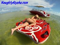 Big titted amateur lounges on an air mattress while naked in a ball cap - Photo #4