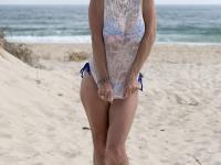 Mature blonde Molly MILF strips totally naked on a sandy beach - Photo #1
