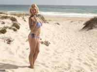 Mature blonde Molly MILF strips totally naked on a sandy beach - Photo #3