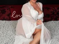 Curvy brunette wife Lady Lyne shows her big tits and masturbates in a solo - Photo #1