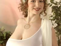 Busty shemale Christy Marks gets naked in a seductive manner - Photo #1