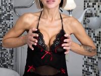 Solo girl with short blonde hair Anna Love spreads her pussy in a bathroom - Photo #3