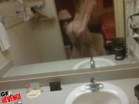 Sporty girlfriend taking a shower and fingering her shaved cunt - Photo #15