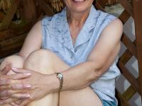 Short-haired granny Dee strips naked & shows her big ass in the garden - Photo #2