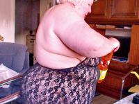 Chubby granny Marie Theres shows her big saggy tits & ass while changing - Photo #1