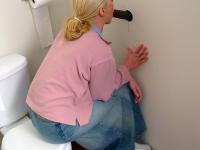 Horny white girl Jamie Woods sucks off a black cock via a gloryhole - Photo #3