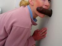 Horny white girl Jamie Woods sucks off a black cock via a gloryhole - Photo #5