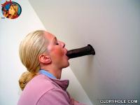Horny white girl Jamie Woods sucks off a black cock via a gloryhole - Photo #8