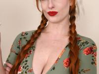 Over 30 redhead Alex Harper wets her big tits before showing her bush - Photo #1