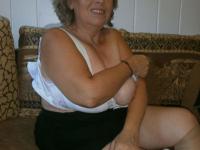Old woman with large boobs pulls down pantyhose to finger her natural pussy - Photo #13