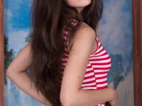Long-legged model Sasha Cane on all fours playing with her hairy pussy lips - Photo #1