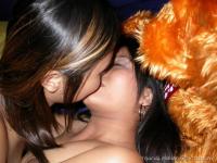 Young Asian girls undress before lesbian sex commences on a bed - Photo #7