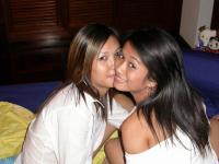 Young Asian girls undress before lesbian sex commences on a bed - Photo #9
