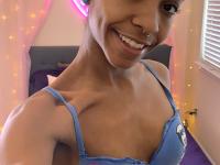 Skinny ebony babe flaunts her small breasts in a sexy bedroom striptease - Photo #11