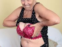 Sexy granny Savana flashes upskirt underwear before unleashing her large boobs - Photo #16