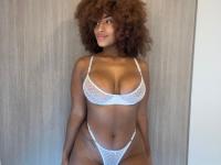 Black girl sports a huge afro while showing her tattooed butt in a thong - Photo #10