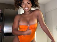 Ebony solo girl with a full head of curly hair models a lot of outfits - Photo #5